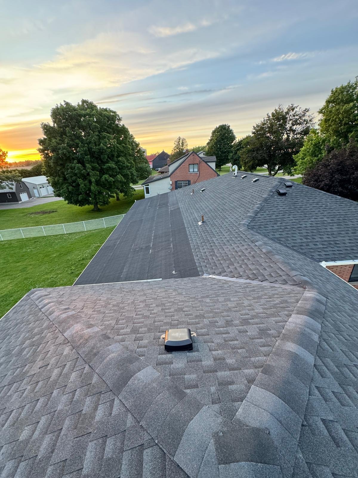 Completed multi-slope residential shingle roof